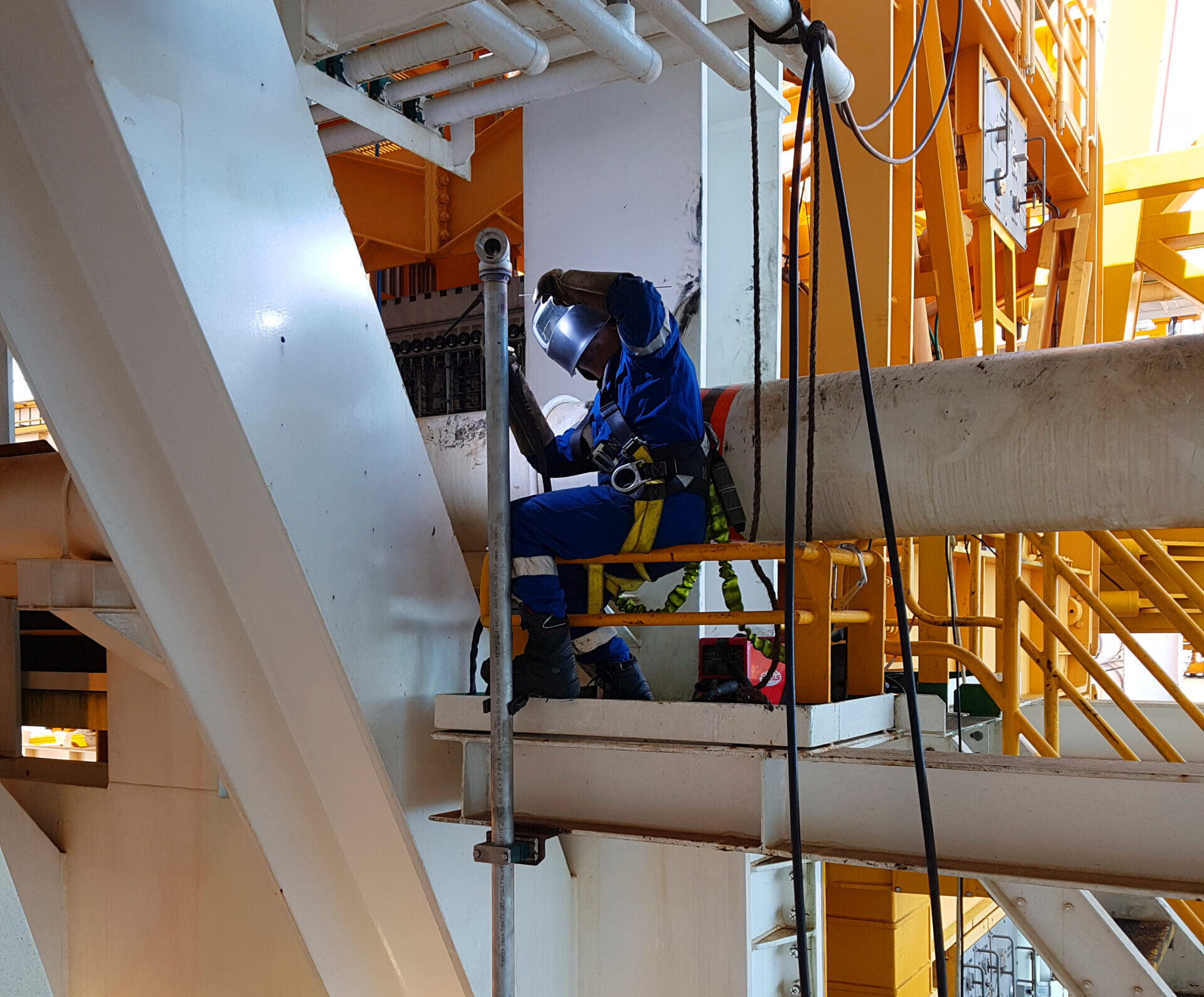 Welder Professional working at height
