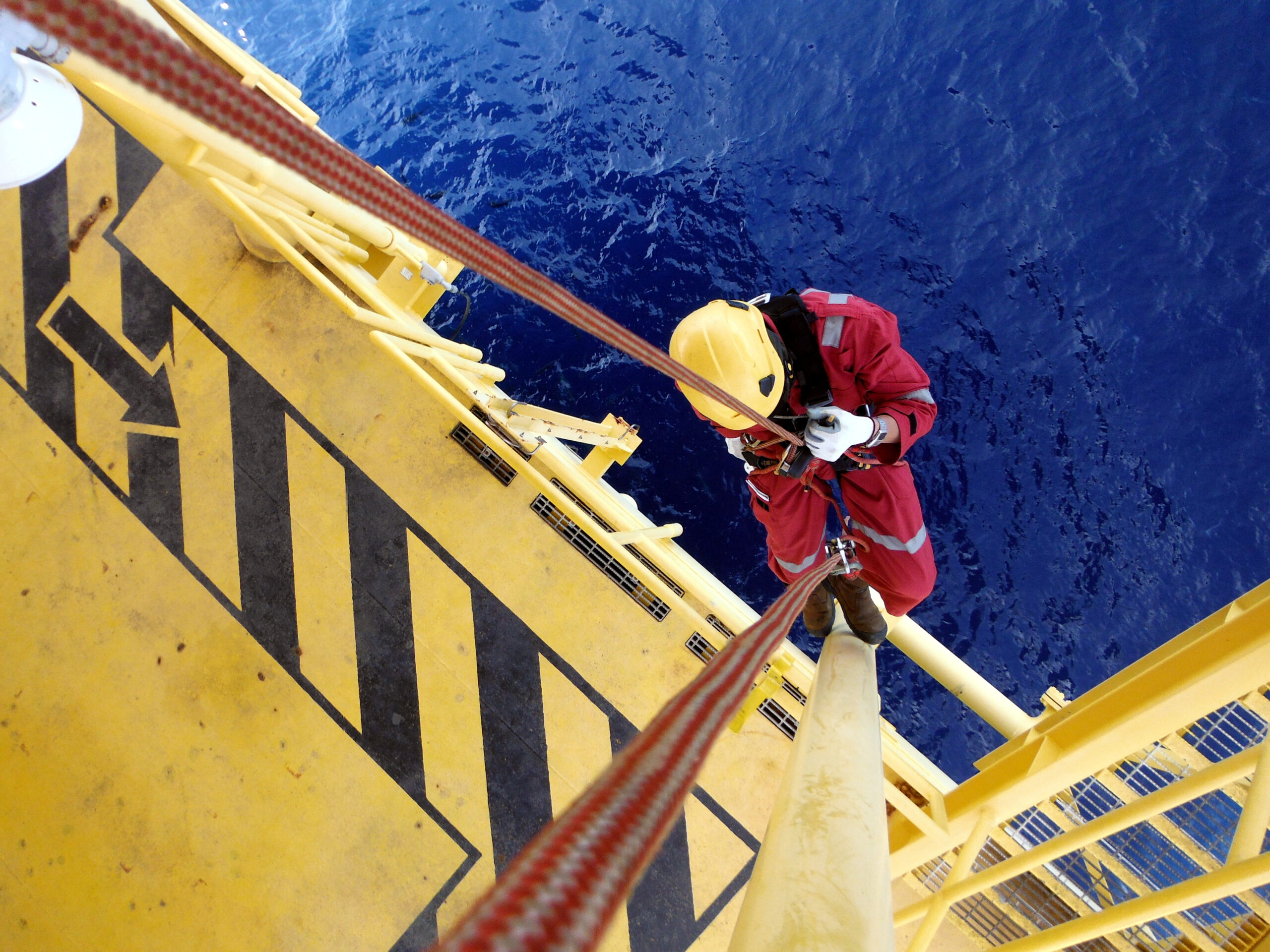 Offshore Worker Using Rope Access of Piping Inspection.