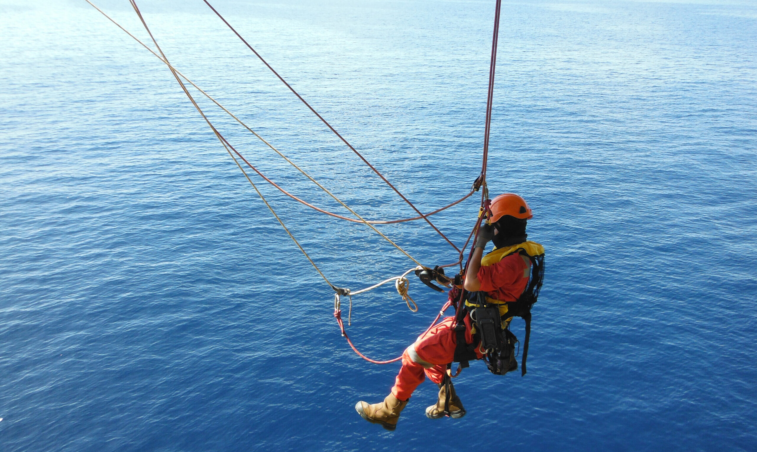 Offshore Worker Using Rope Access of Piping Inspection.