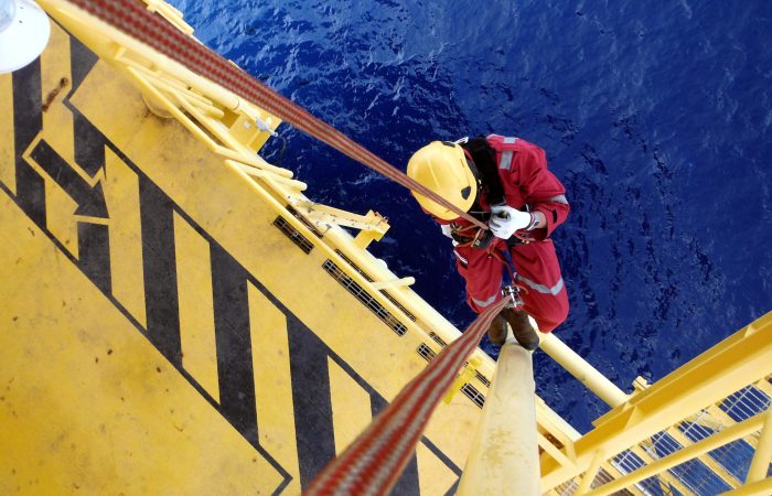 Offshore Worker Using Rope Access of Piping Inspection.