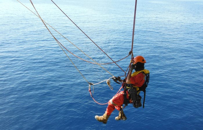 Offshore Worker Using Rope Access of Piping Inspection.